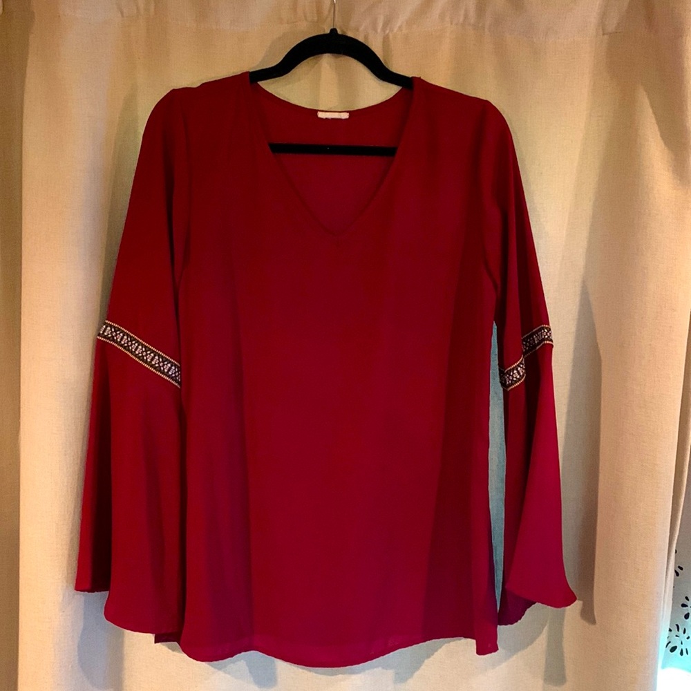 Long bell sleeved maroon blouse